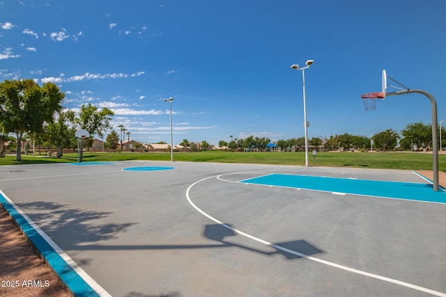 view of basketball court featuring a lawn