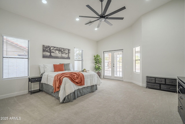 carpeted bedroom featuring access to outside, high vaulted ceiling, french doors, and ceiling fan