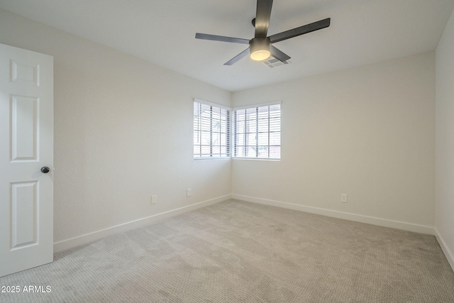 spare room with light carpet and ceiling fan