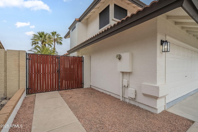 view of side of property featuring a garage