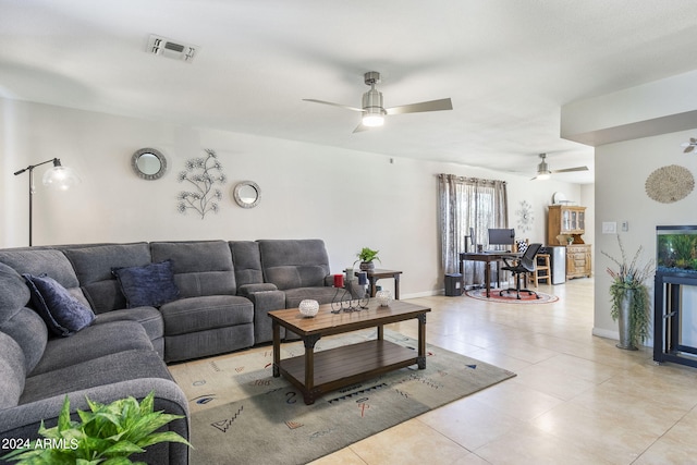 tiled living room with ceiling fan