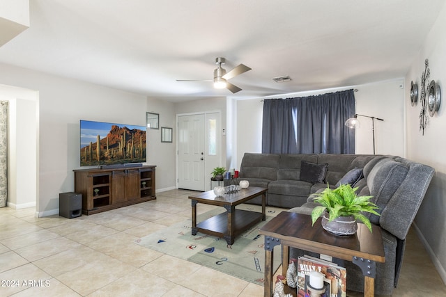 living room featuring light tile patterned floors and ceiling fan