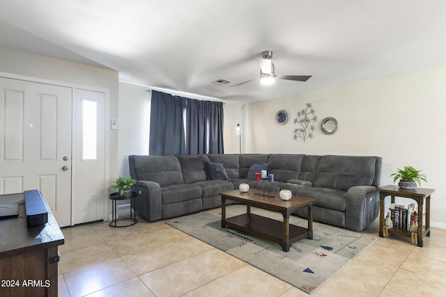 tiled living room featuring ceiling fan