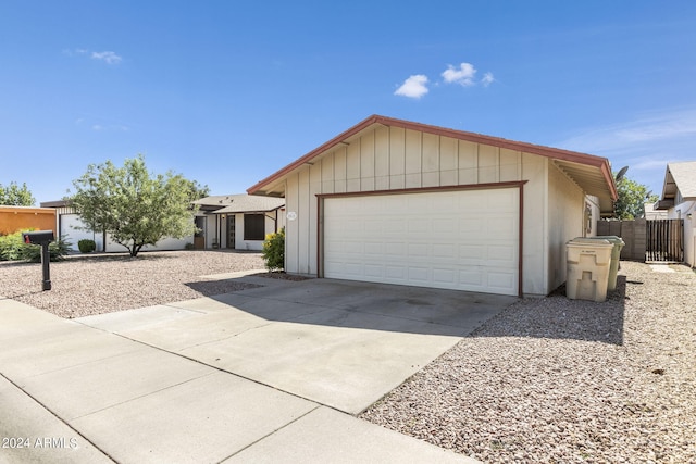 ranch-style home featuring a garage