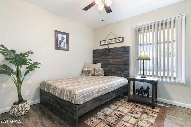 bedroom with ceiling fan and wood-type flooring