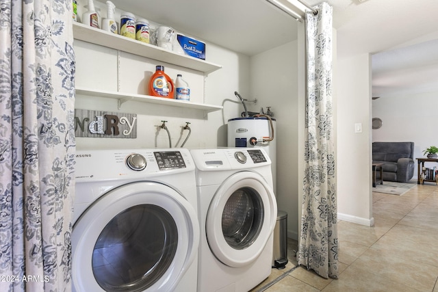 laundry room with independent washer and dryer, electric water heater, and light tile patterned flooring