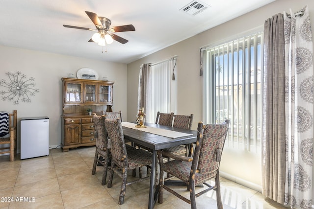 dining room featuring light tile patterned floors and ceiling fan