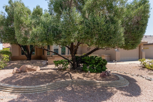 view of front of property with a garage