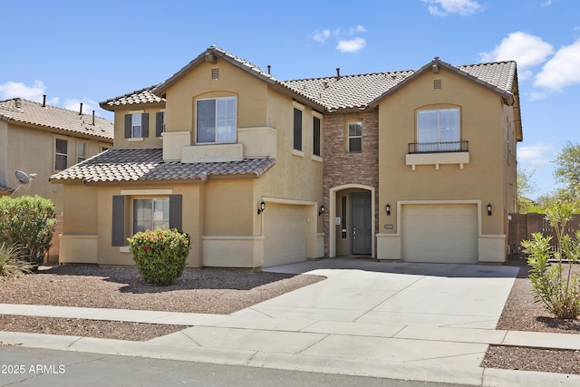 11959 W Vernon Ave, Avondale, AZ 85392 - mediterranean / spanish house featuring a tile roof, stucco siding, and an attached garage