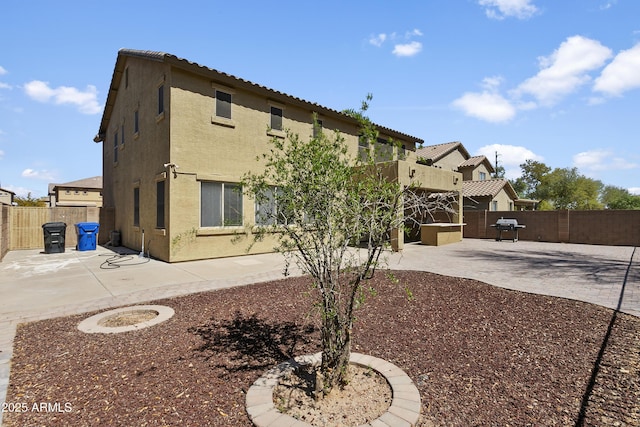 11959 W Vernon Ave, Avondale, AZ 85392 - back of house with a fenced backyard, stucco siding, and a patio area