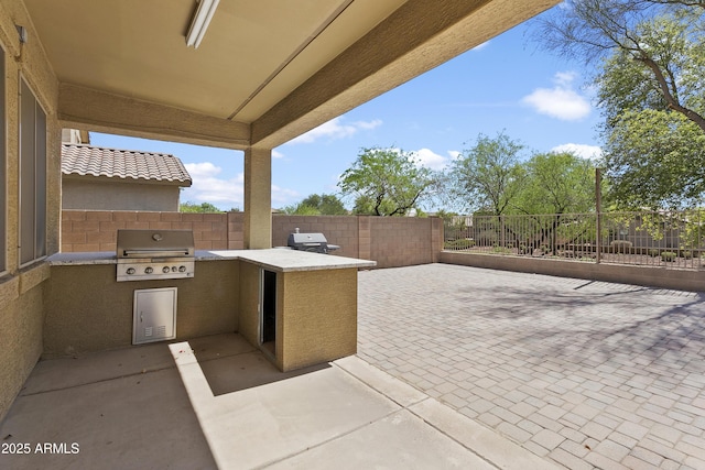 11959 W Vernon Ave, Avondale, AZ 85392 - view of patio / terrace with exterior kitchen, area for grilling, and fence private yard