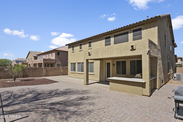 11959 W Vernon Ave, Avondale, AZ 85392 - rear view of property with stucco siding, a fenced backyard, central AC, and a patio area