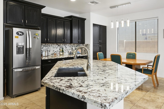11959 W Vernon Ave, Avondale, AZ 85392 - kitchen with a sink, stainless steel fridge with ice dispenser, dark cabinets, and visible vents