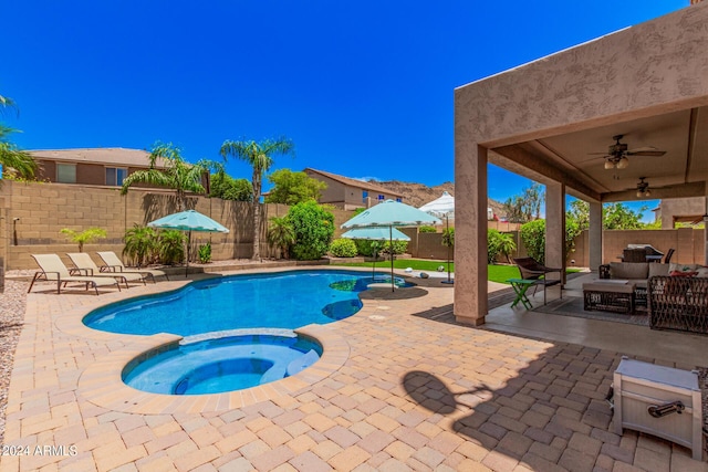 view of pool featuring an in ground hot tub, an outdoor living space, a patio, and ceiling fan