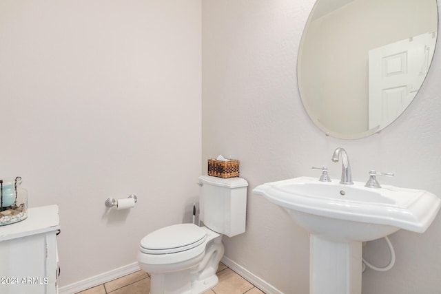 bathroom with tile patterned floors and toilet