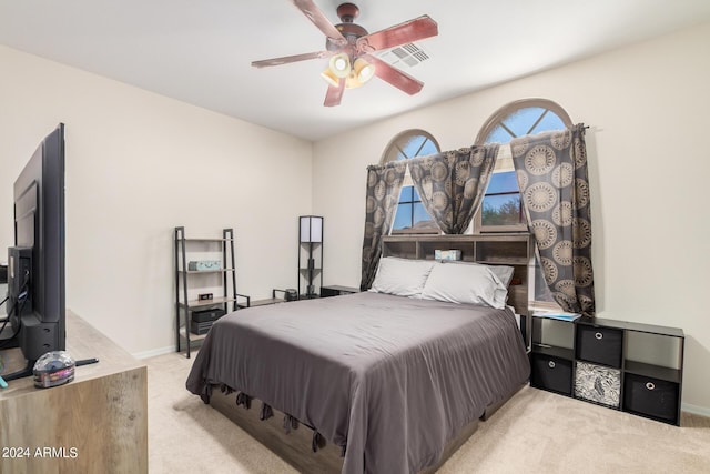 carpeted bedroom featuring ceiling fan