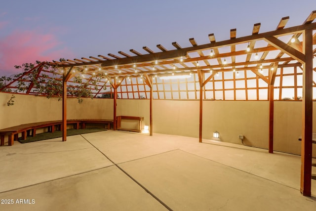 view of patio terrace at dusk