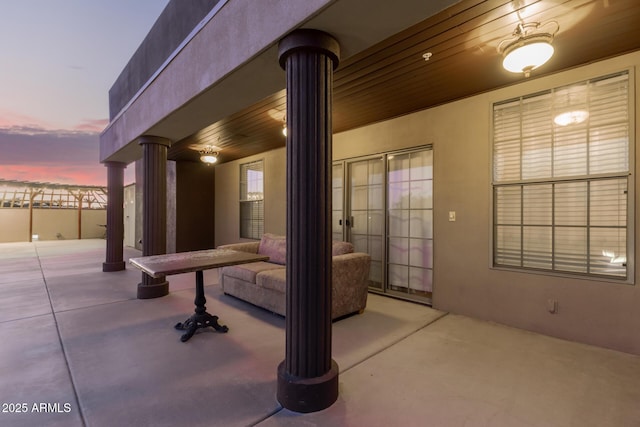 view of patio terrace at dusk