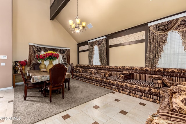 tiled dining room with a chandelier, beam ceiling, and high vaulted ceiling