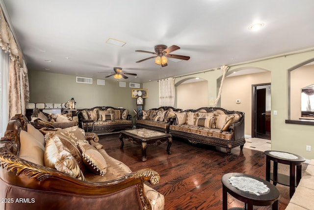 living room with ceiling fan and wood-type flooring