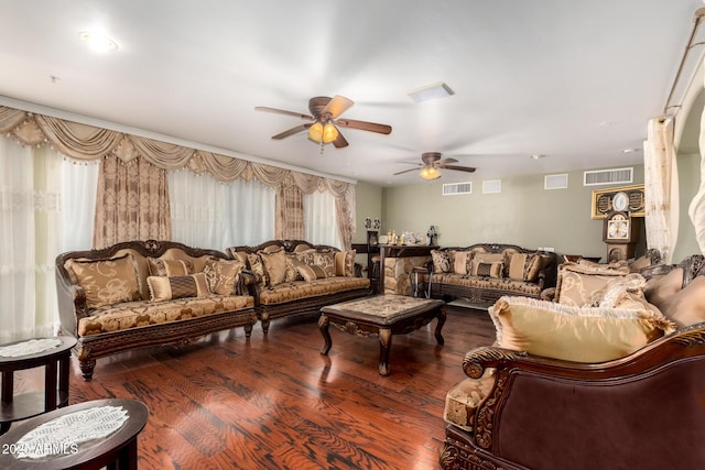 living room featuring ceiling fan and dark hardwood / wood-style flooring