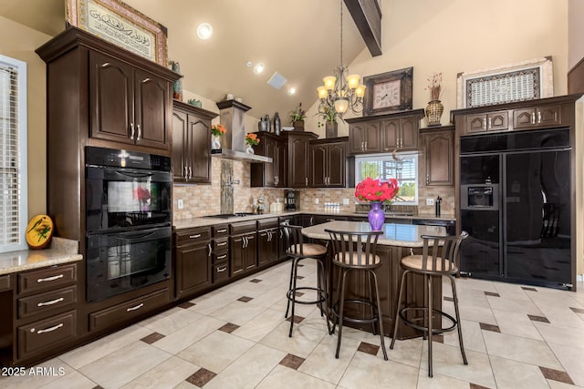 kitchen with backsplash, double oven, wall chimney range hood, beamed ceiling, and built in refrigerator