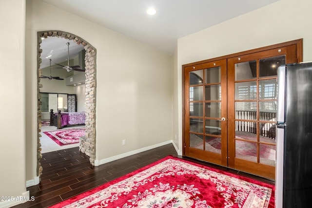 interior space with french doors and ceiling fan