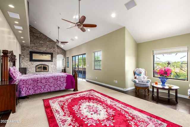 bedroom featuring a fireplace, high vaulted ceiling, and ceiling fan