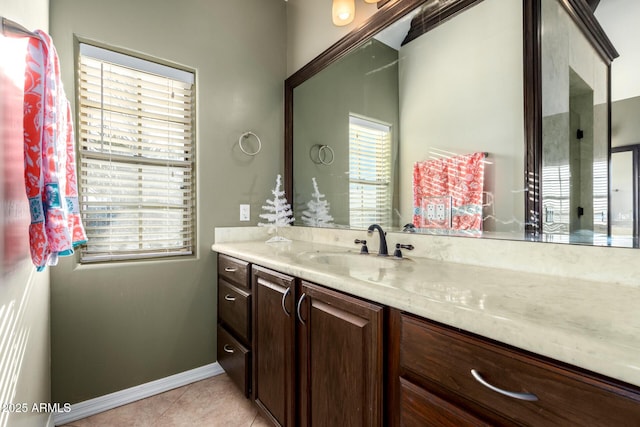 bathroom with tile patterned flooring and vanity