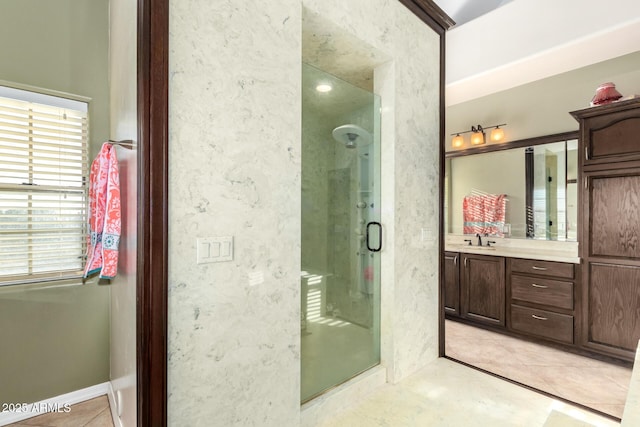 bathroom with vanity and walk in shower