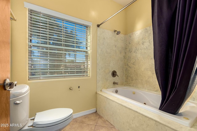 bathroom with tile patterned floors, shower / bath combo, and toilet