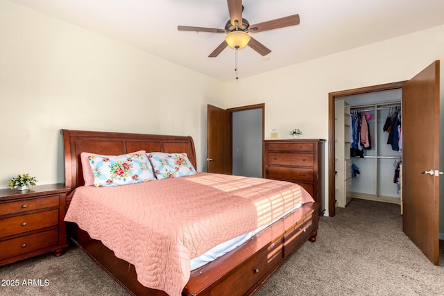 bedroom with ceiling fan, light carpet, and a closet