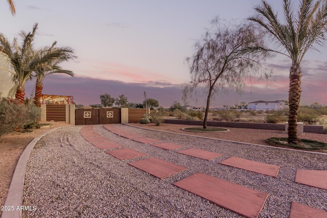 view of yard at dusk