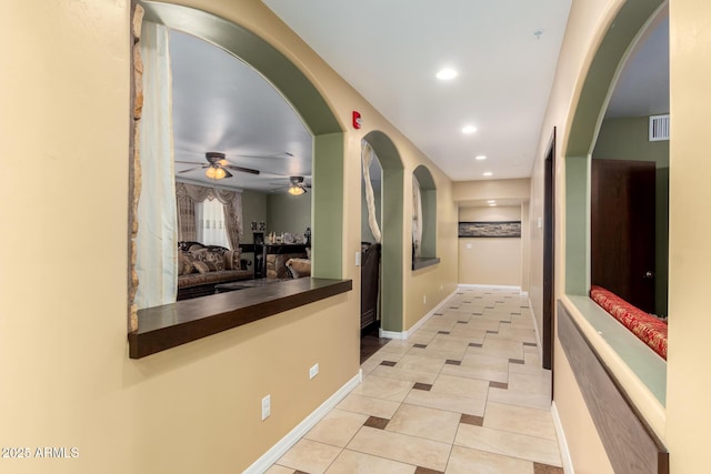 hallway featuring light tile patterned floors