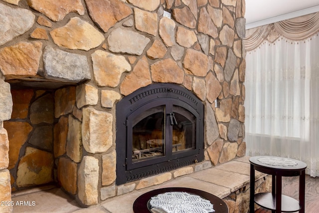 room details featuring crown molding and a fireplace