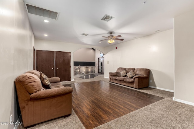 living room featuring ceiling fan and carpet floors