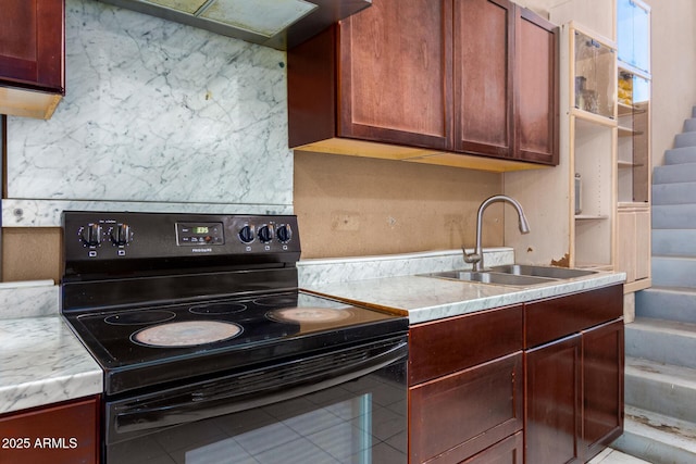 kitchen featuring sink, light tile patterned floors, custom range hood, and black range with electric cooktop