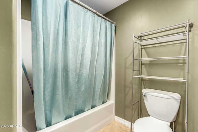 bathroom featuring tile patterned floors, shower / bath combo, and toilet