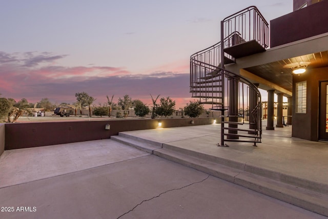 view of patio terrace at dusk