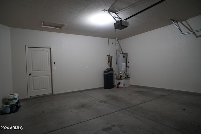 garage with a garage door opener and gas water heater