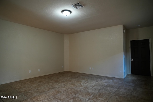 empty room featuring tile patterned flooring