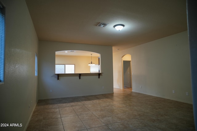 empty room featuring tile patterned floors