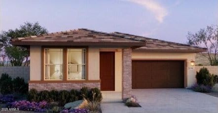 5597 S 253rd Ave, Buckeye, AZ 85326 - prairie-style house with concrete driveway, an attached garage, and stucco siding