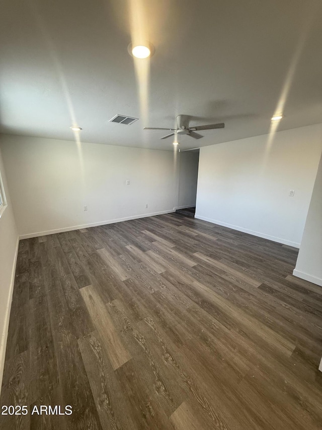 3824 W Puget Ave, Phoenix, AZ 85051 - empty room with ceiling fan and dark wood-style floors