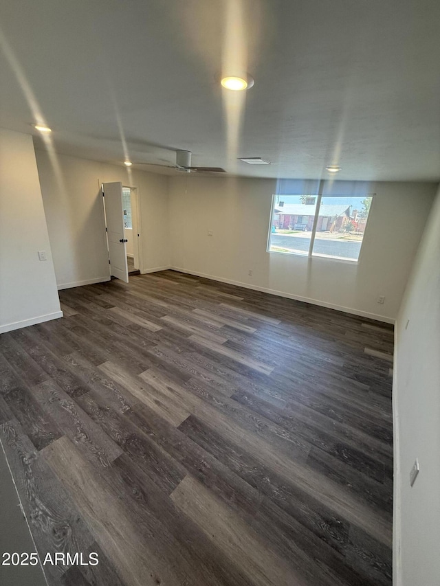 3824 W Puget Ave, Phoenix, AZ 85051 - empty room featuring dark wood-style flooring and baseboards