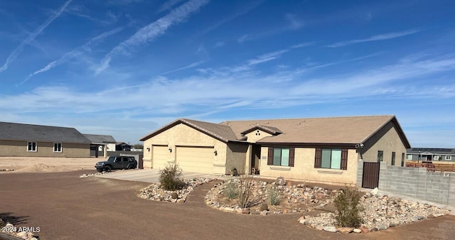 ranch-style house featuring a garage