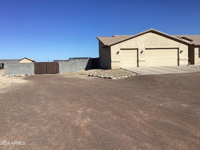 view of property exterior with a garage