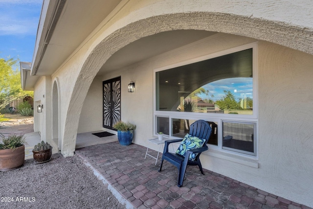 entrance to property with a patio