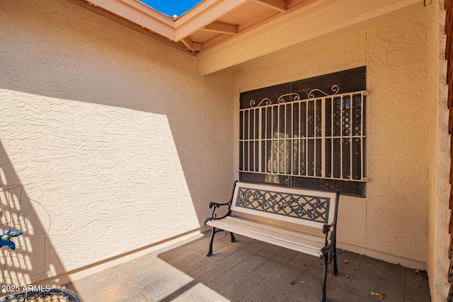 entrance to property with stucco siding