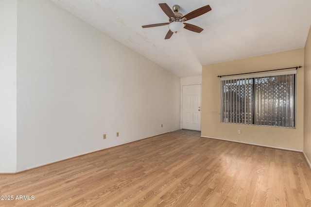 empty room with light wood-type flooring, lofted ceiling, and ceiling fan